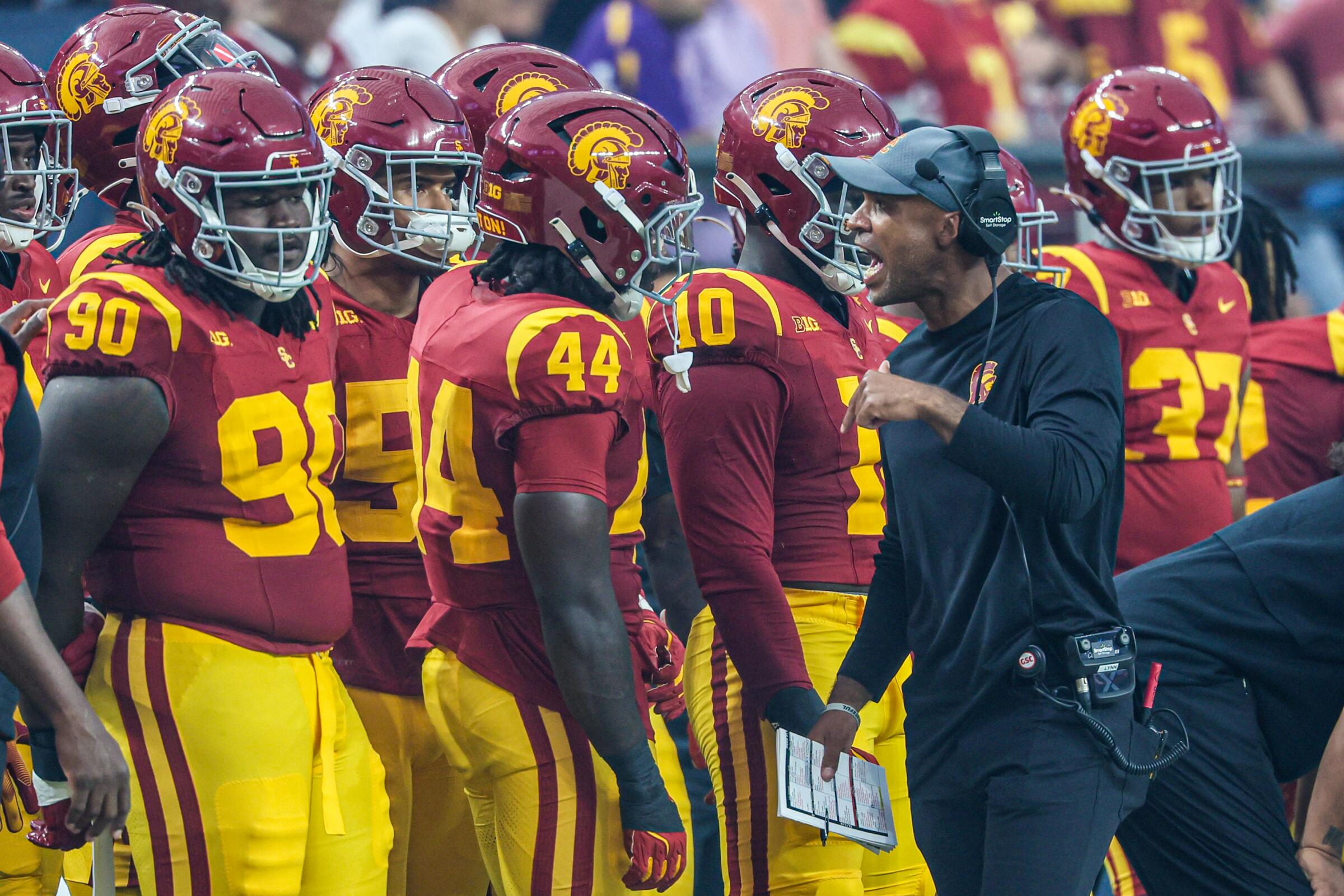 USC defensive coordinator D'Anton Lynn addresses players on the sidelines during the team's win over LSU