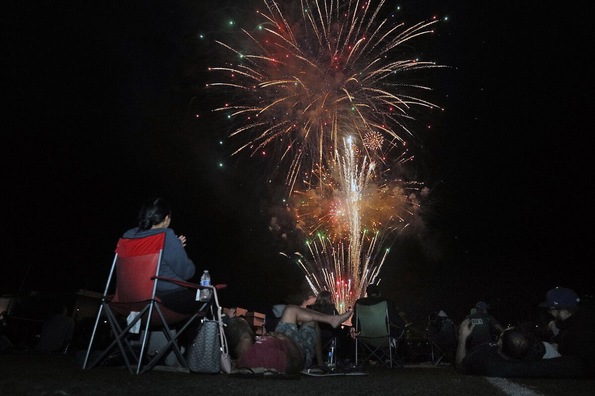 A small portion of the large crowd on the football field watching fireworks at the 14th annual Crescenta Valley Fireworks Assn. Fireworks Extravaganza at Crescenta Valley High School on July 4, 2019. 