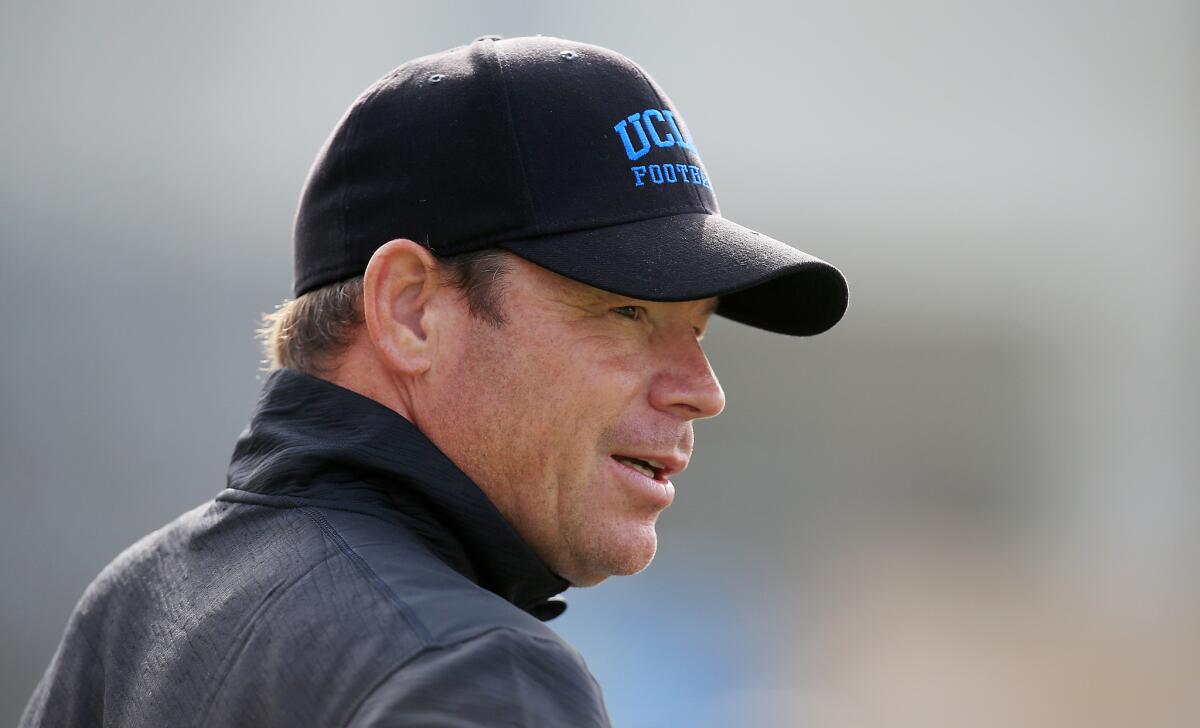 UCLA Coach Jim Mora watches the Bruins at spring practice in March.