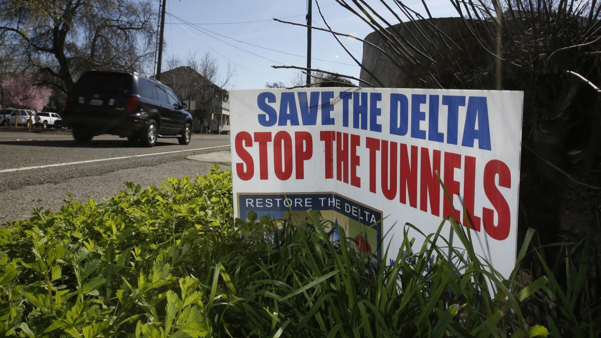 A sign opposing a proposed tunnel plan to ship water through the Sacramento-San Joaquin River Delta to Southern California is displayed near Freeport, Calif., in 2016.