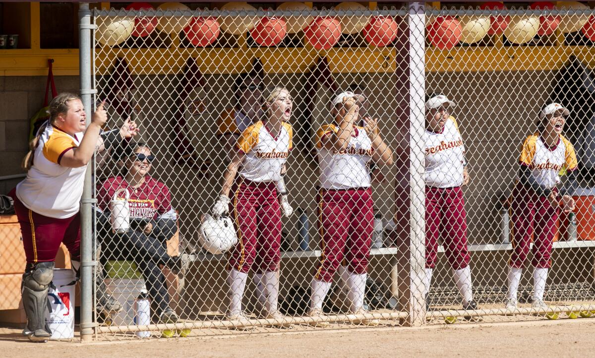 The Ocean View dugout cheers for Kaya Collado during a CIF Southern Section Division 5 quarterfinal game on Thursday.