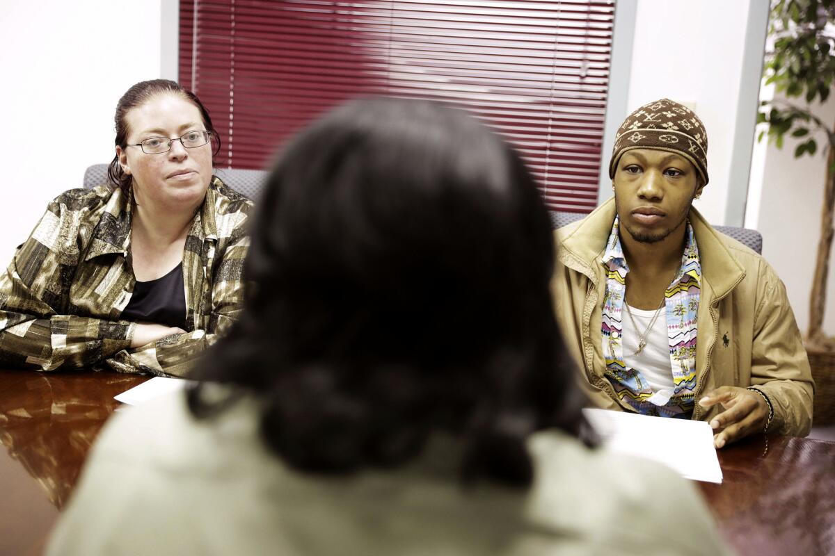 Sabrina Britt, left, and Nino Alexander interview for a job during a recruiting event in Atlanta on Thursday.