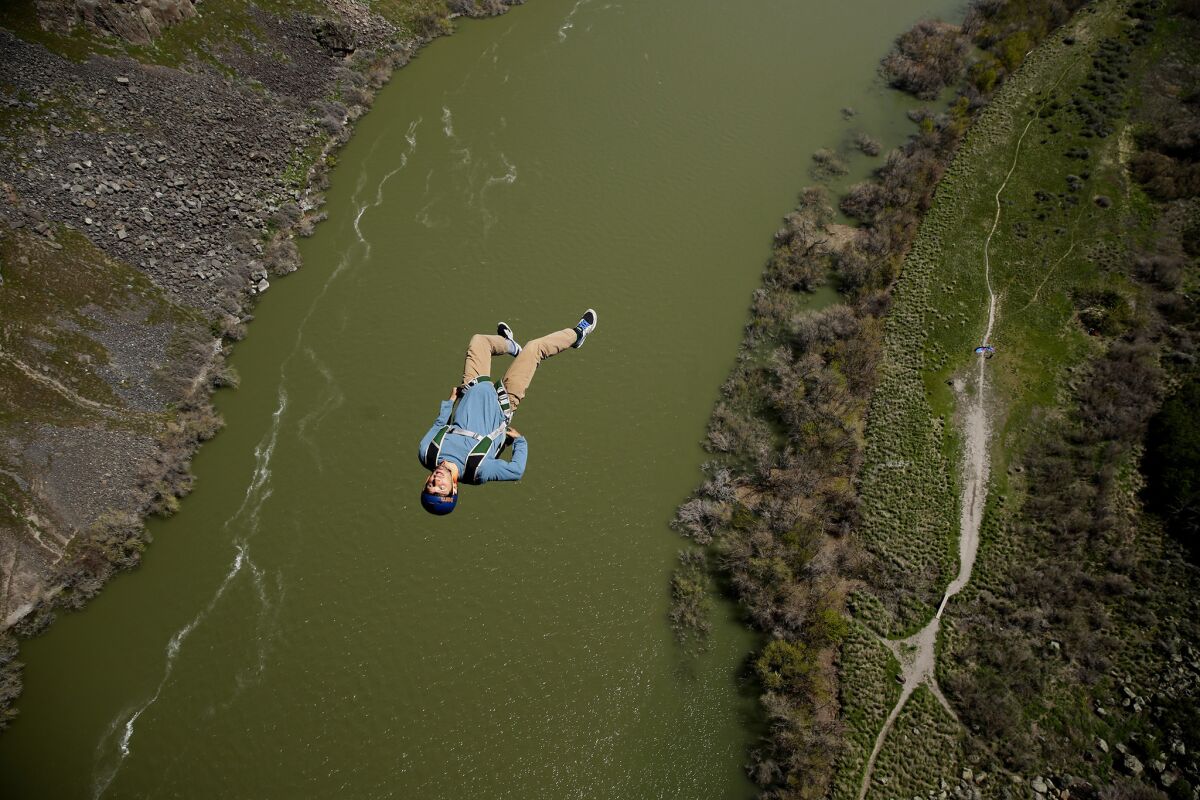 A base jumper leaps from the Perrine Bridge above the Snake River, where one can jump without a permit. (Robert Gauthier / Los Angeles Times)