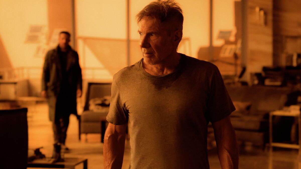 Ryan Gosling as K and Harrison Ford as Rick Deckard in "Blade Runner 2049."