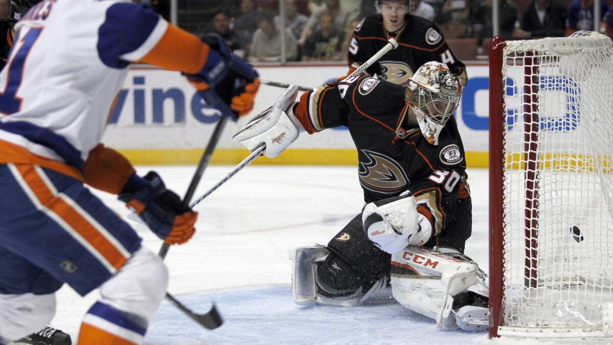 New York Islanders center John Tavares, left, scores on Ducks goalie Jason LaBarbera during the first period of the Ducks' 3-2 overtime loss Wednesday.