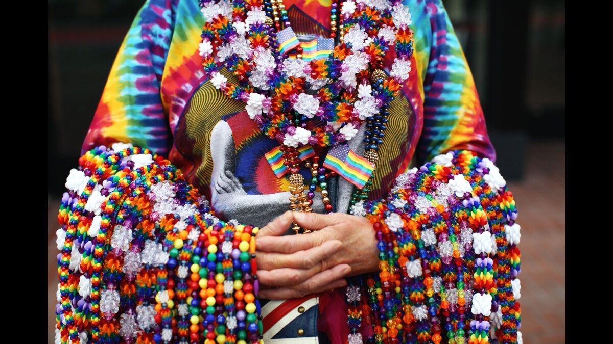 Anna Oliver, of San Francisco, sells beaded necklaces at the 45th annual San Francisco Pride Celebration & Parade held on Sunday.