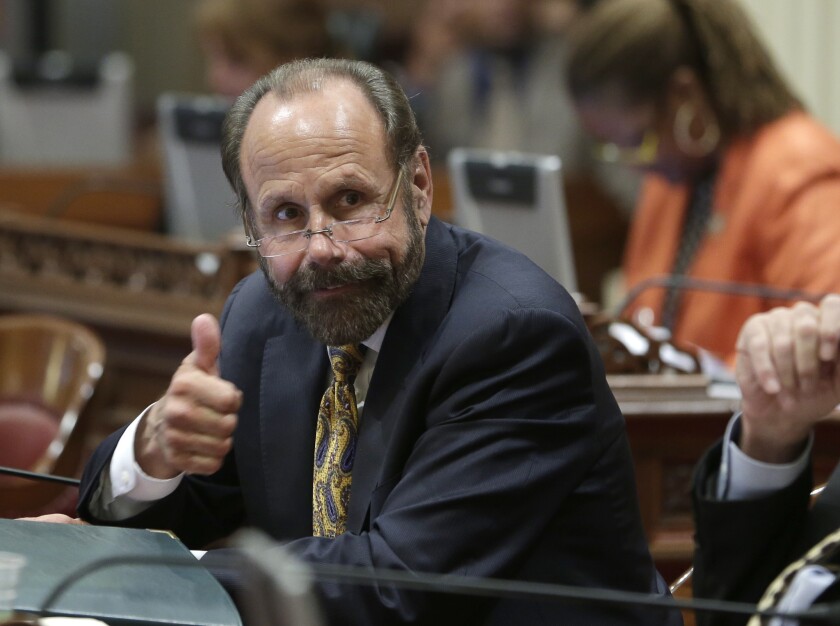 State Sen. Jerry Hill, D-San Mateo, gives a thumb up to a colleague during a June meeting. On Monday he won Senate approval of a bill that would make it illegal for websites to charge a fee to Californians to take down mugshots.