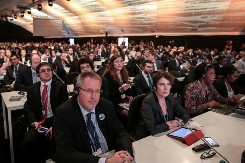 Delegates attend the opening session of the U.N. climate conference in Marrakesh, Morocco, on Monday.