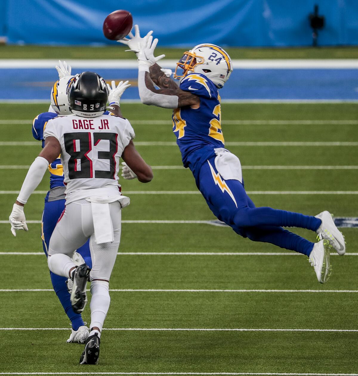 Chargers safety Nasir Adderley breaks up a pass intended for Atlanta Falcons wide receiver Russell Gage.