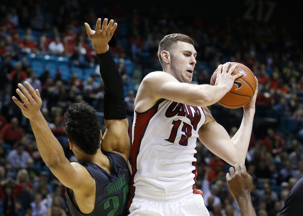 UNLV forward Ben Carter, right, grabs a rebound over Oregon forward Dillon Brooks during the second half of a game Dec. 4.