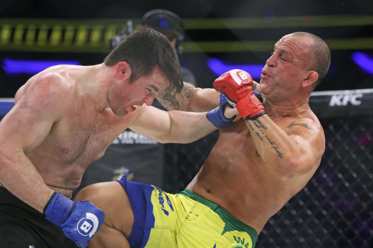 Chael Sonnen, left, trades punches with Wanderlei Silva at Bellator 180 on June 25 in New York.