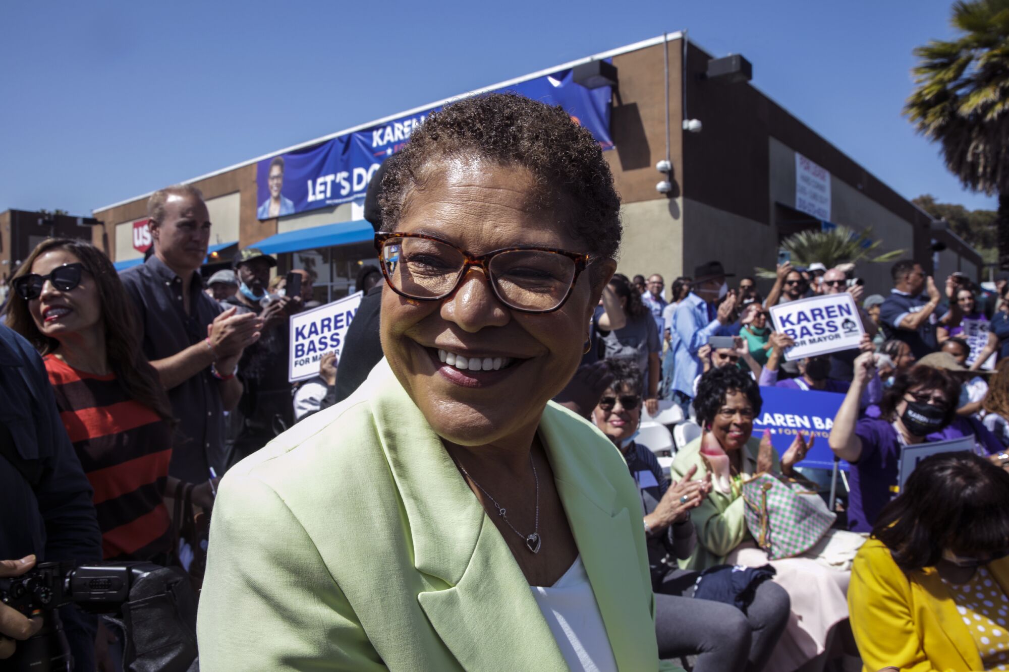 Supporters surround Rep. Karen Bass outside her mayoral campaign headquarters.