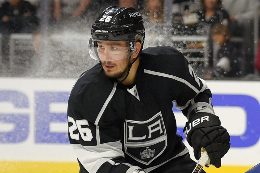 FILE - In this Oct. 16, 2014, file photo, Los Angeles Kings defenseman Slava Voynov, of Russia, skates during the third period of an NHL hockey game against the St. Louis Blues in Los Angeles. An arbitrator has upheld Voynovs one-season suspension by the NHL but is giving him credit for serving half of it in 2018-19. Commissioner Gary Bettman suspended the former Los Angeles Kings defenseman for the 2019-20 season and 2020 playoffs after it determined he committed acts of domestic violence. The NHL Players Association appealed the ruling. (AP Photo/Mark J. Terrill, File)