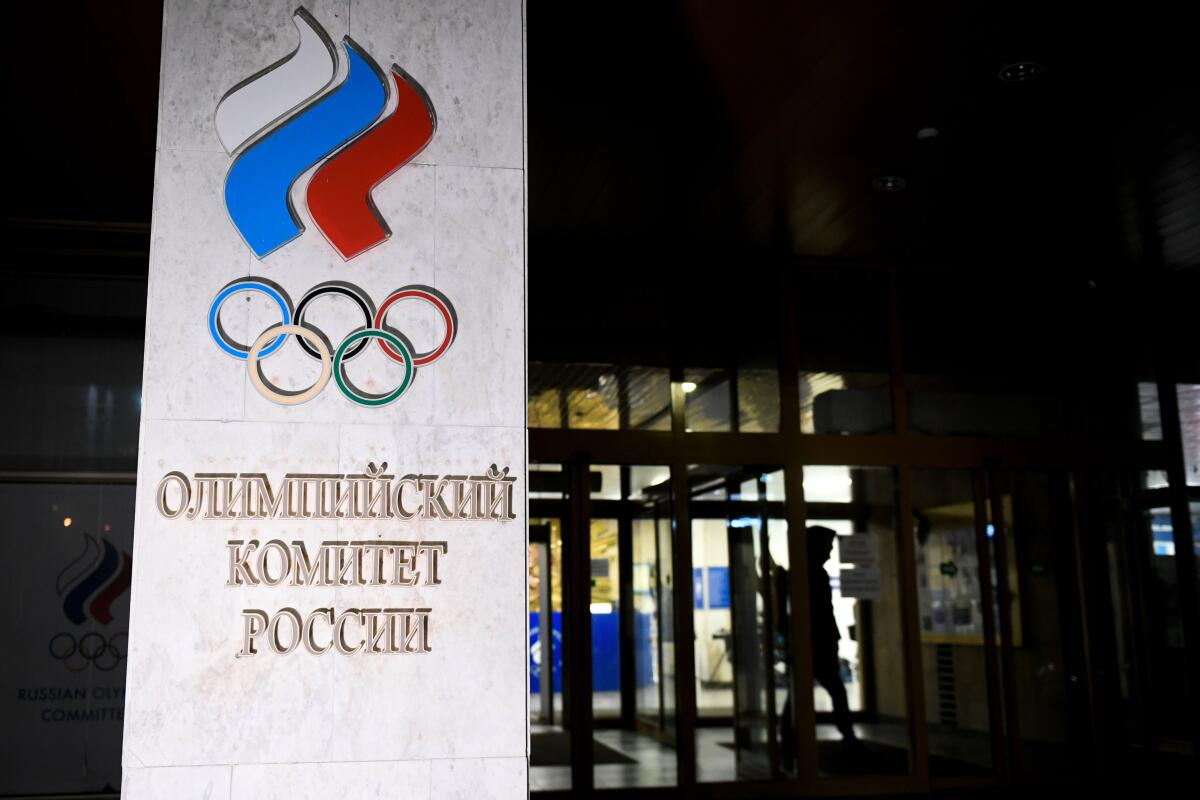 TOPSHOT - A person walks out of the Russian Olympic Committee (ROC) headquarters in Moscow on December 9, 2019. - Russia will miss next year's Tokyo Olympics and the 2022 Beijing Winter Games after the World Anti-Doping Agency on Monday banned the powerhouse from global sporting events for four years over manipulated doping data. (Photo by Alexander NEMENOV / AFP) (Photo by ALEXANDER NEMENOV/AFP via Getty Images) ** OUTS - ELSENT, FPG, CM - OUTS * NM, PH, VA if sourced by CT, LA or MoD **