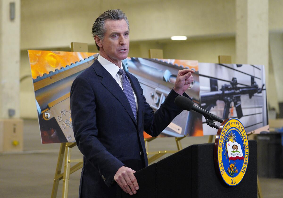 Gov. Gavin Newsom speaks to reporters about gun laws in 2022 at Del Mar Fairgrounds.