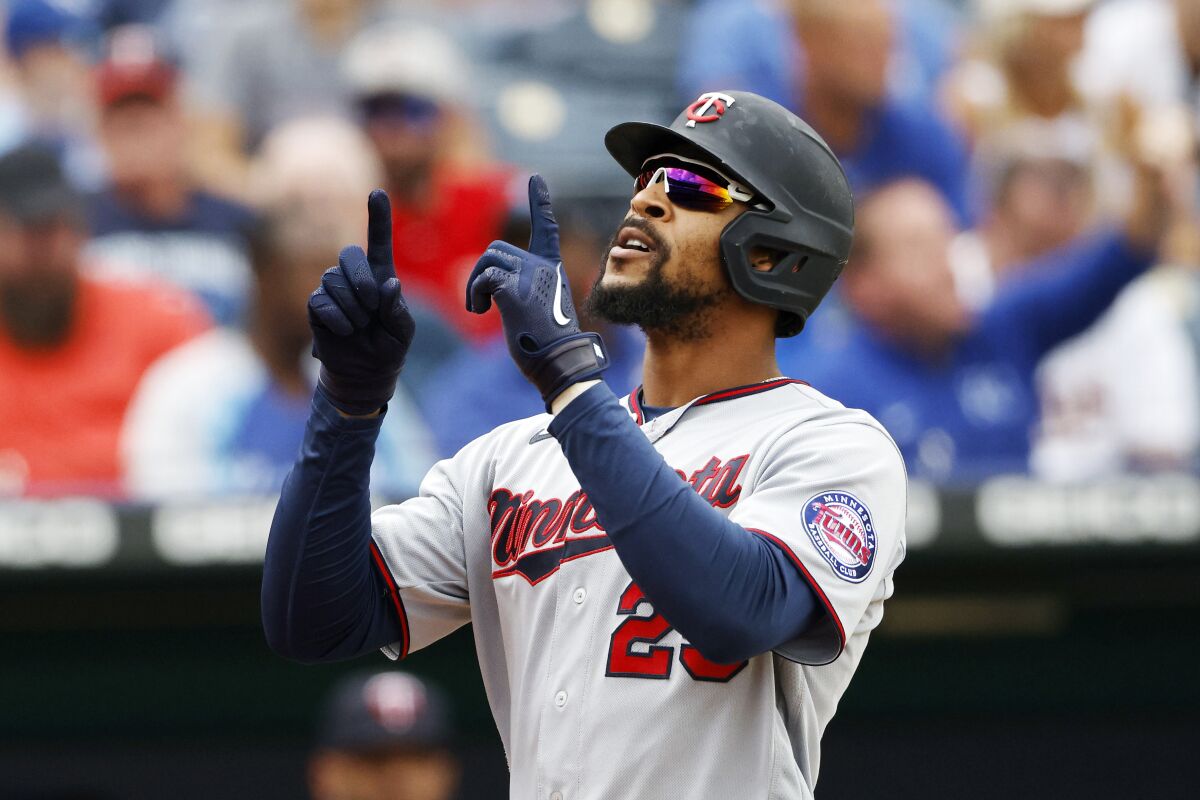 Minnesota Twins' Byron Buxton reacts after hitting a two-run home run during the fifth inning of a baseball game against the Kansas City Royals in Kansas City, Mo., Sunday, Oct. 3, 2021. (AP Photo/Colin E. Braley)