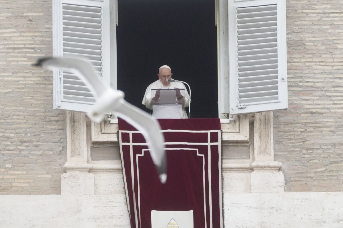 Pope Francis delivers the Angelus noon prayer in St. Peter's Square at the Vatican, Sunday, March 19, 2023. (AP Photo/Gregorio Borgia)