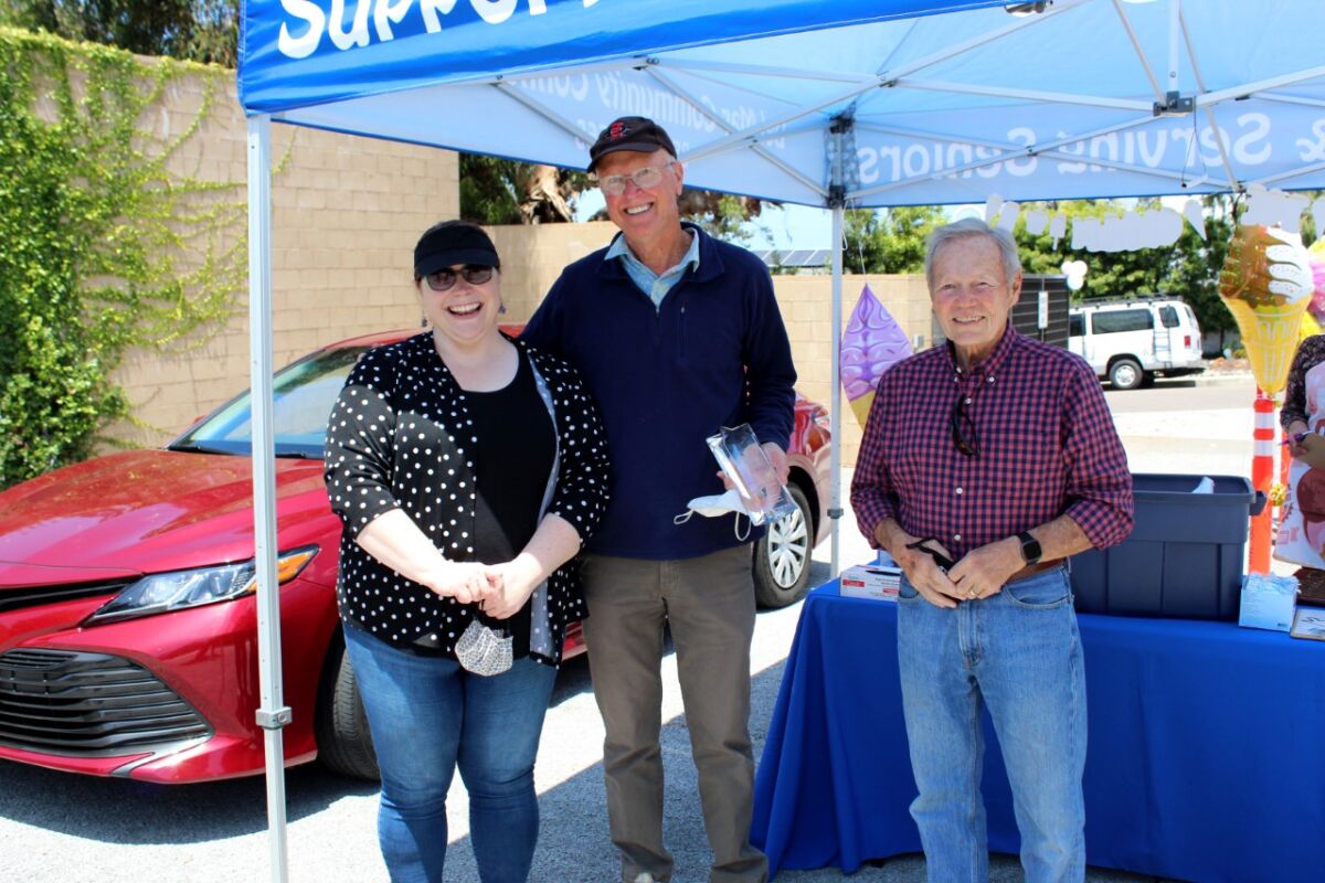 Tom Cleworth (center) receiving his award from Ashley Simpkins and Terry Kopanski.