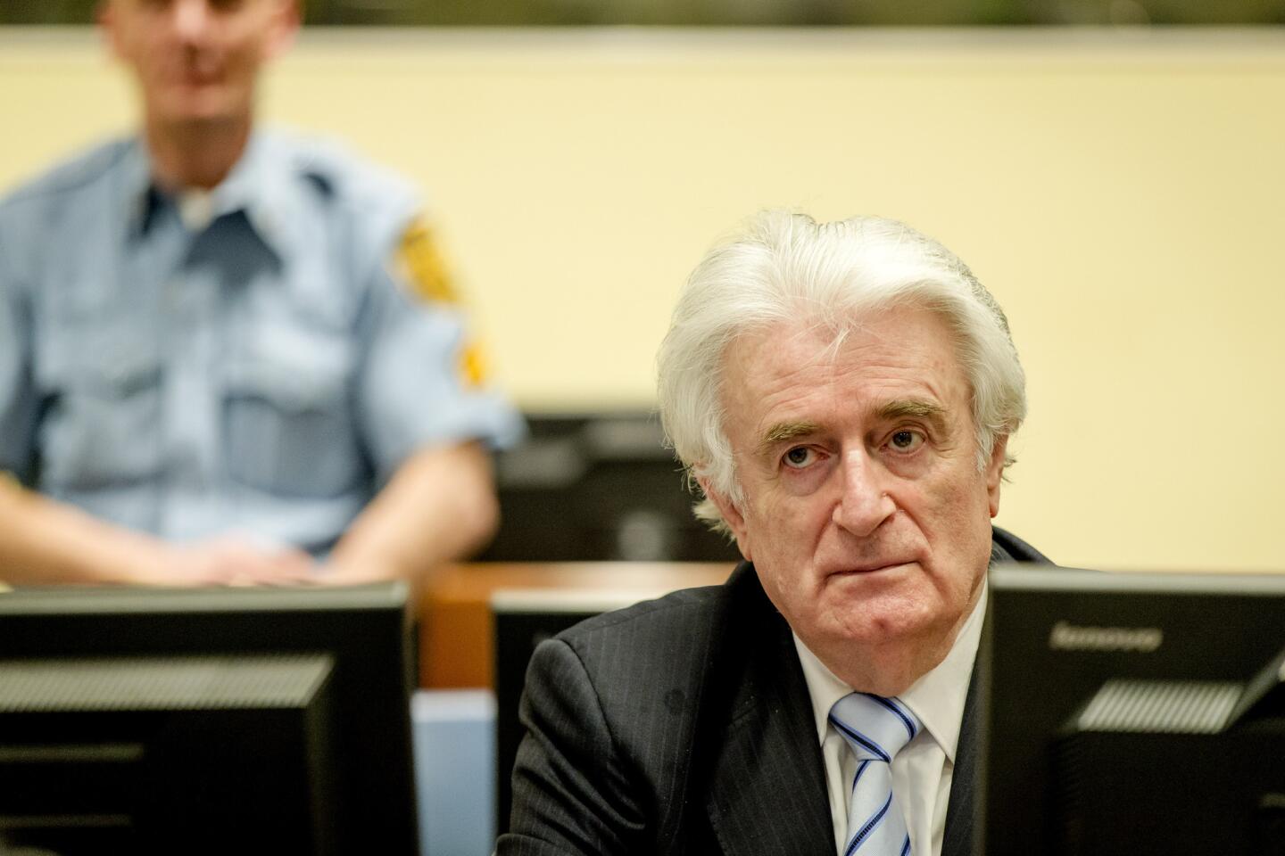 Bosnian Serb wartime leader Radovan Karadzic sits in the courtroom for the reading of his verdict at the International Criminal Tribunal for Former Yugoslavia in The Hague on March 24, 2016.