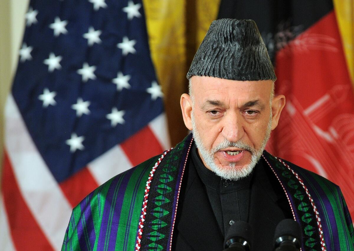 Afghan President Hamid Karzai answers a question during a joint press conference with President Obama in the East Room at the White House in Washington, D.C.