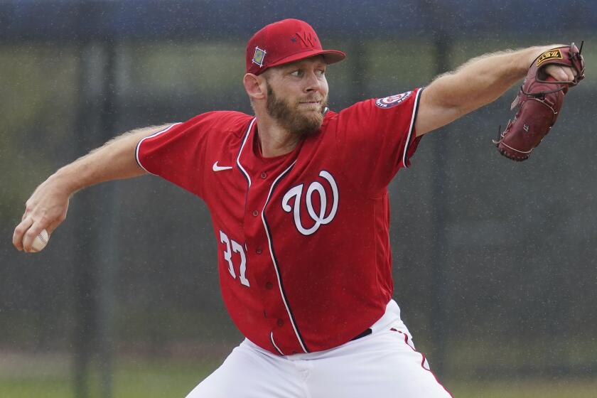 FILE - Washington Nationals pitcher Stephen Strasburg throws live batting practice in a drizzle during the team's spring training baseball workout March 15, 2022, in West Palm Beach, Fla. Strasburg was put on the 60-day injured list by the Washington Nationals ahead of Thursday's, March 28, 2024, opener at Cincinnati. (AP Photo/Sue Ogrocki, File)