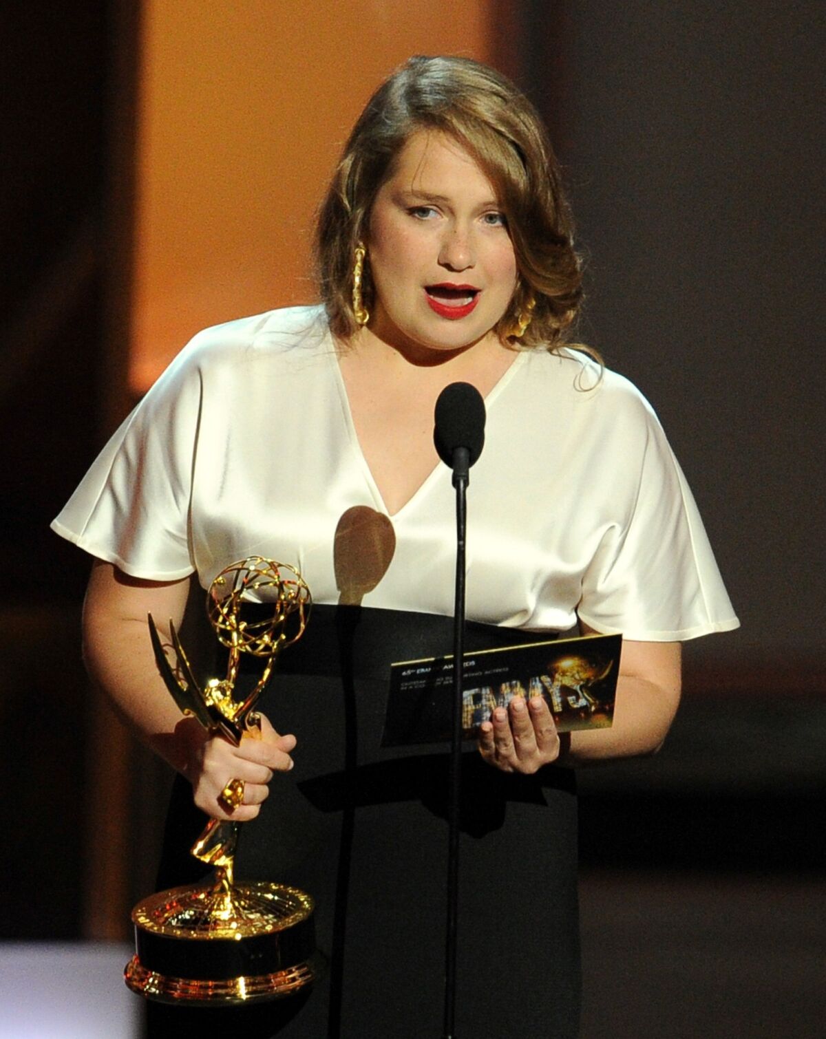 Merrit Wever from "Nurse Jackie" onstage accepting her Emmy award.