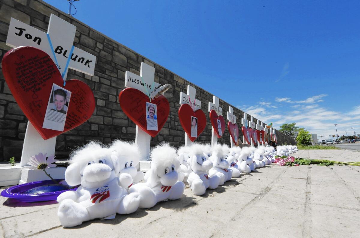Crosses stand along a street in Aurora, Colo., on July 20 to honor victims of the 2012 theater massacre and to mark its third anniversary. The penalty phase of the James E. Holmes trial begins July 22.