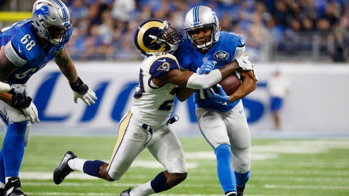 Lions receiver Golden Tate is tackled by Rams cornerback Lamarcus Joyner during a game on Oct. 16.