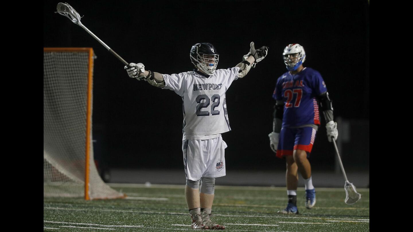 Newport Harbor High's Rhett Farmer (22) reacts after scoring against Los Alamitos during the first half in a Sunset League game on Wednesday, April 4.