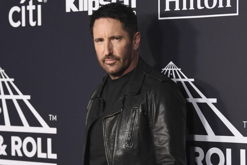 FILE - Trent Reznor arrives at the Rock & Roll Hall of Fame induction ceremony in New York on March 29, 2019. Reznor turns 56 on May 17. (Photo by Evan Agostini/Invision/AP, File)
