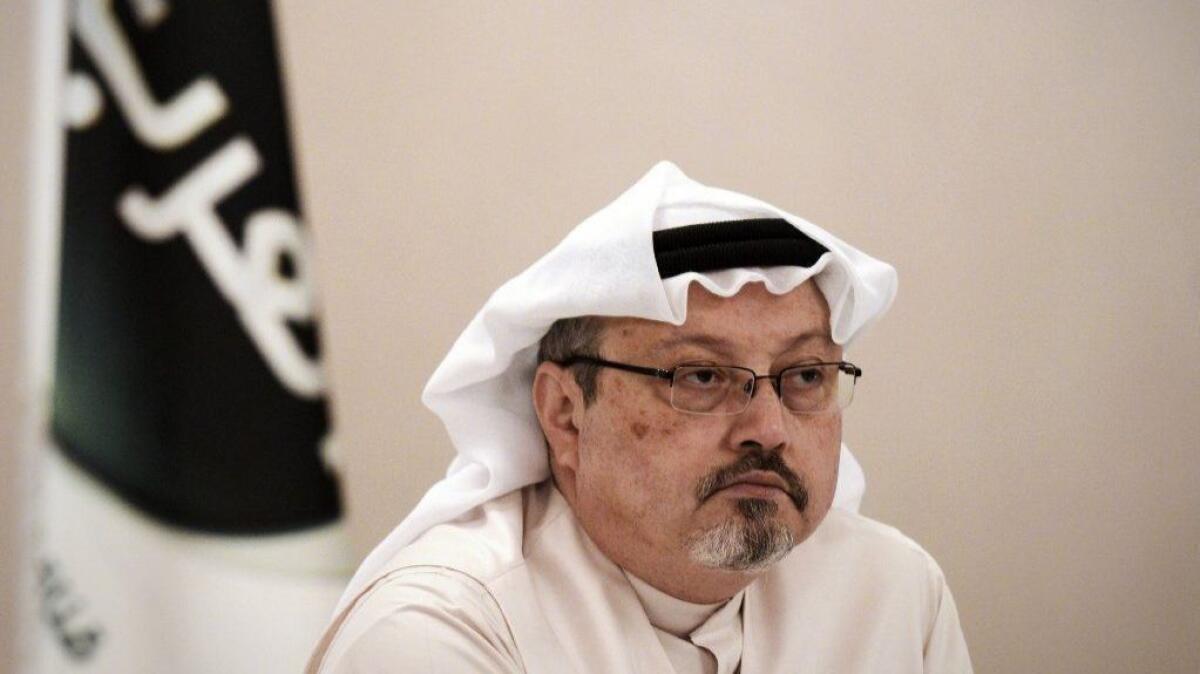 Journalist Jamal Khashoggi looks on during a news conference in the Bahraini capital, Manama, in 2014.