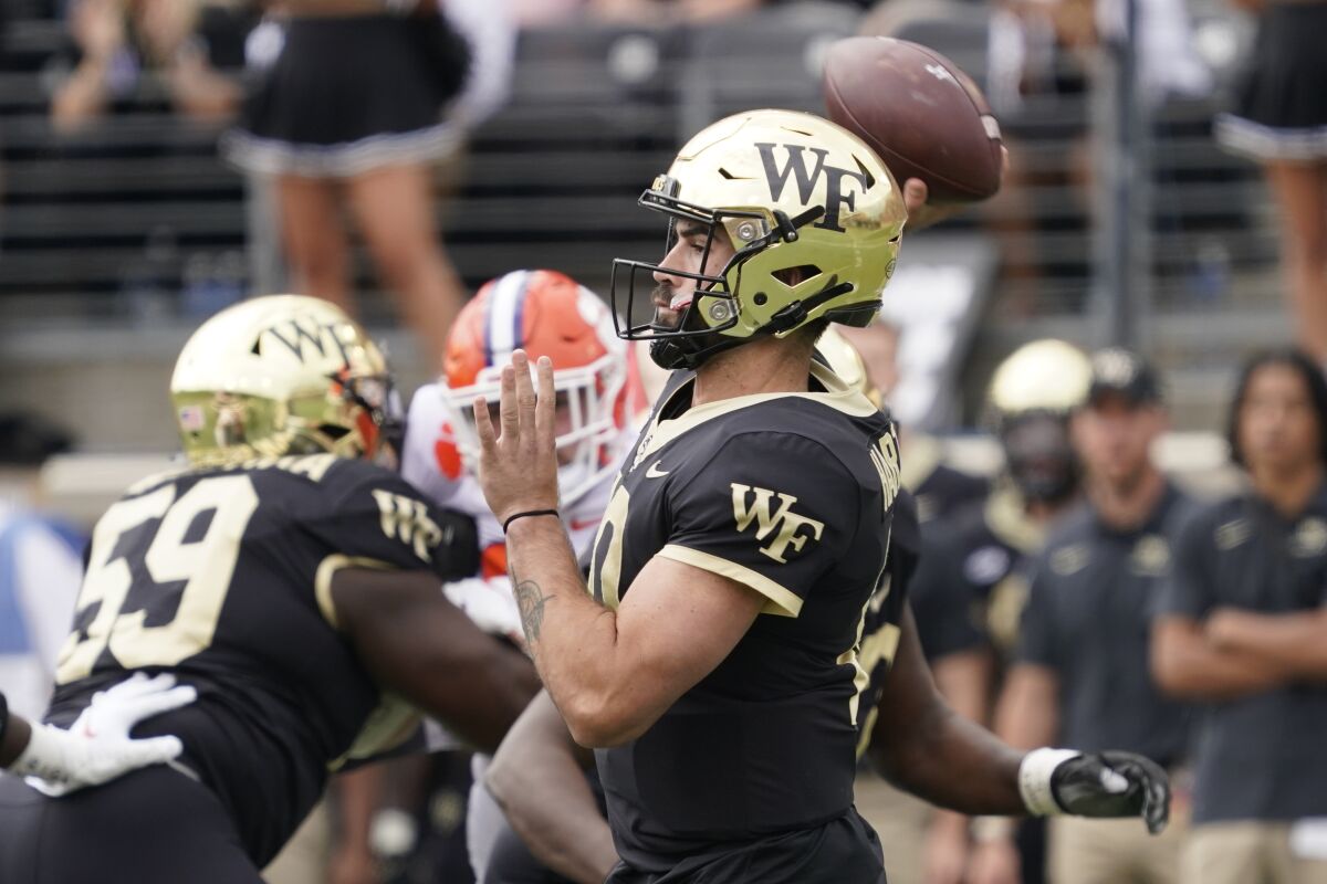 Wake Forest quarterback Sam Hartman looks to pass during an overtime loss to Clemson last week.