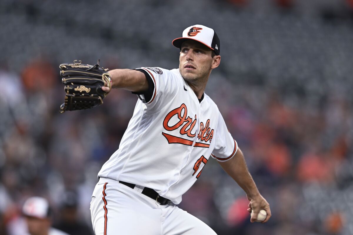Baltimore Orioles starting pitcher John Means throws to a Milwaukee Brewers batter during the first inning of a baseball game Wednesday, April 13, 2022, in Baltimore. (AP Photo/Gail Burton)