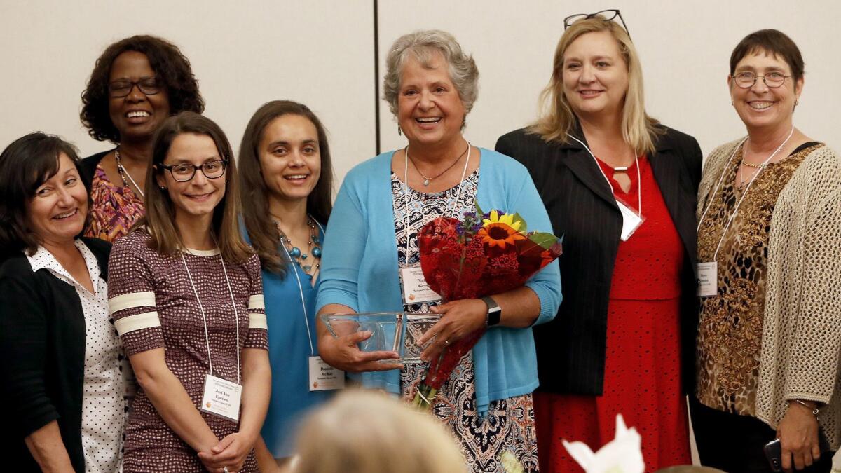 Natalie Gerdes, center, is pictured with colleagues after being recognized by the Orange County School Nurses Organization as School Nurse of the Year. Gerdes, a nurse for 42 years, has been with Newport-Mesa Unified School District since 2003.