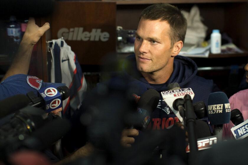 New England Patriots quarterback Tom Brady speaks to the media in the locker room prior to the team's practice on Sunday.