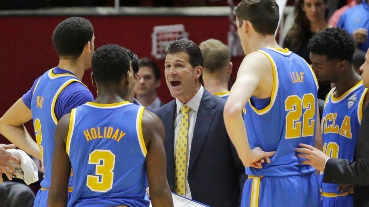 UCLA Coach Steve Alford speaks to his players during a timeout in the second half of a game against Utah on Saturday.