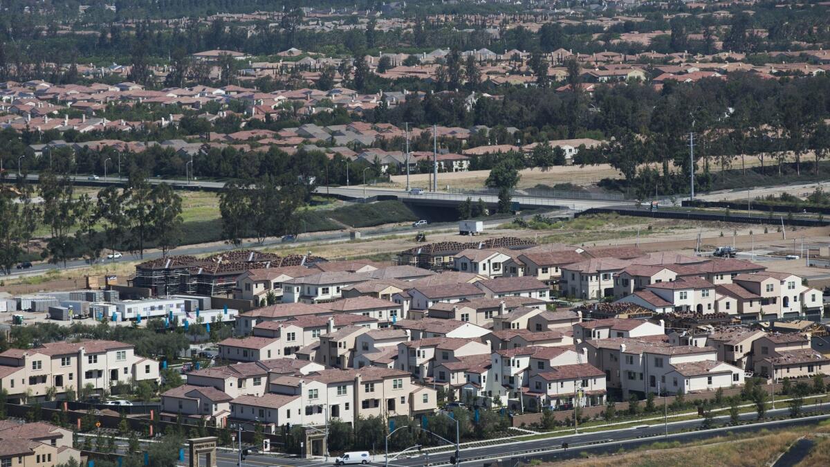 A view from the Great Park balloon of newer neighborhoods in Irvine. Locals say they marvel at the pace of building in the town that they now call "a metropolis." New developments abound in the city where the median age of residents is 34. (Allen J. Schaben / Los Angeles Times)