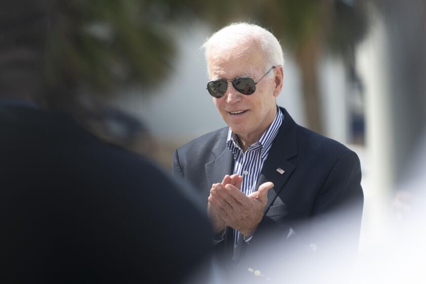 President Joe Biden visits Fisherman's Wharf at Fort Myers Beach, Fla., Wednesday, Oct. 5, 2022, to see the damage caused by Hurricane Ian. (Saul Young/Knoxville News Sentinel via AP, Pool)