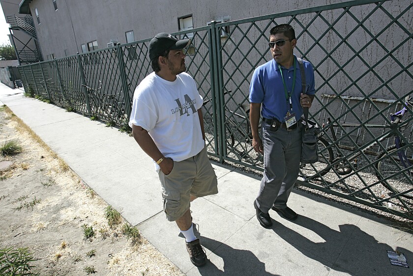 Alfredo Ruiz and his caseworker, Julio Alvarez, right, discuss treatment issues in North Hollywood on June 14, 2007.