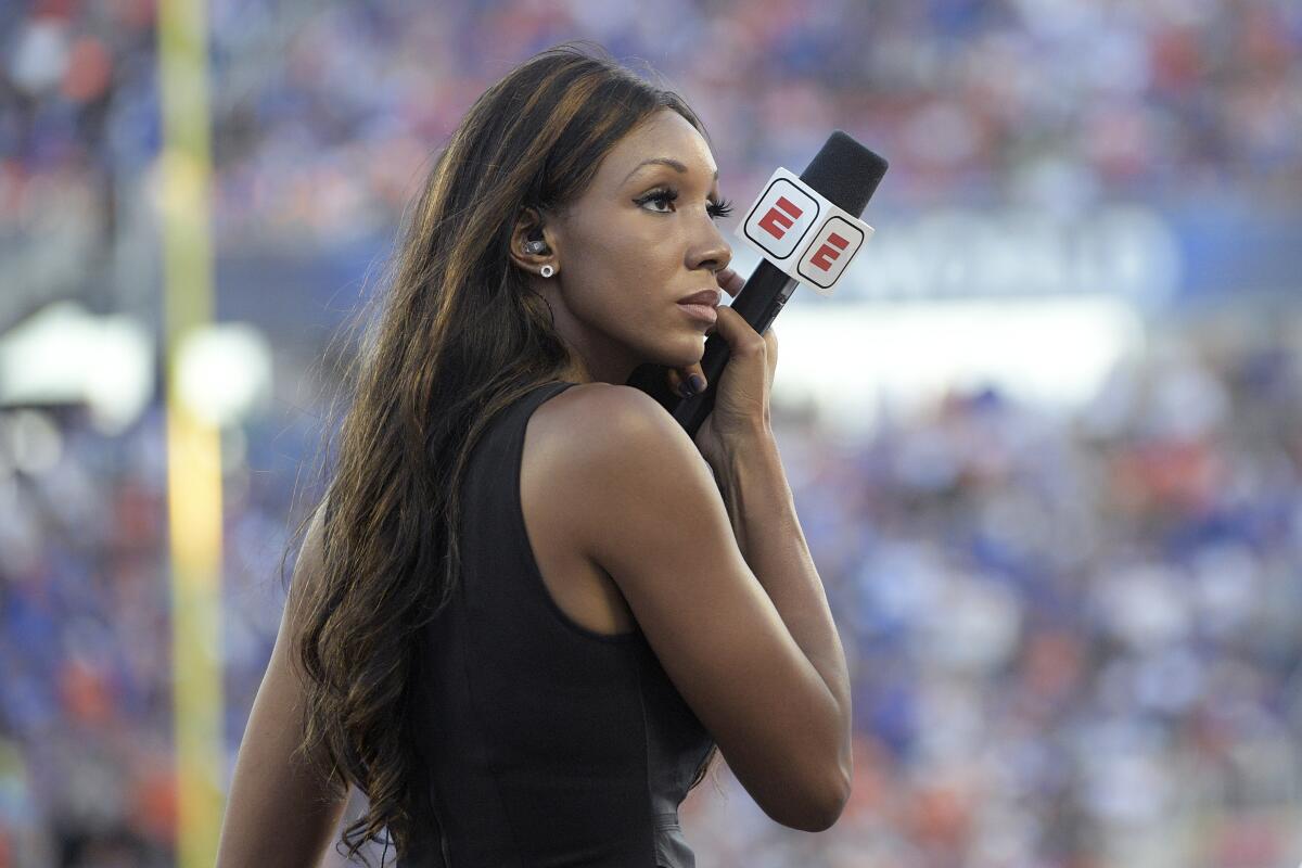 ESPN's Maria Taylor works from the sideline during the first half of a game between Miami and Florida on Aug. 24, 2019. 