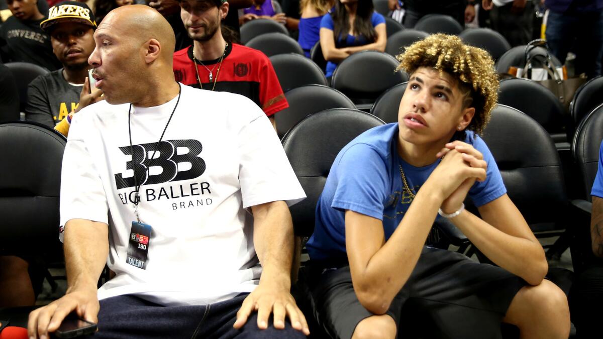LaVar Ball and son LaMelo watch the Big 3 tournament this summer at Staples Center.