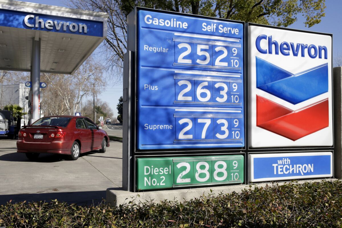 Gas prices are displayed at a Chevron gas station in Sacramento on Feb. 8.