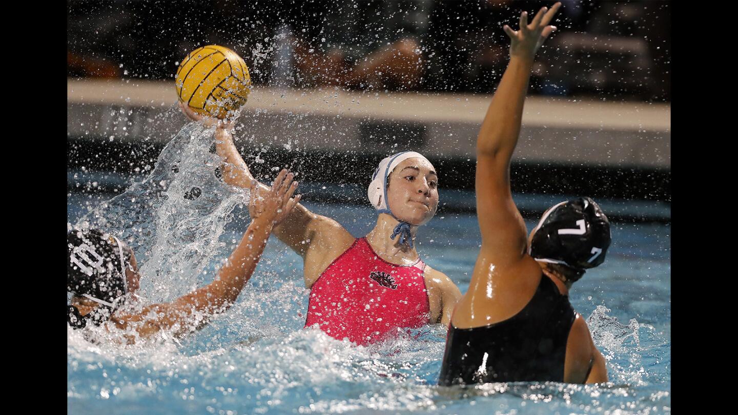 Corona del Mar High's Chloe Harbilas, center, competes against Foothill during the first half in a nonleague game on Friday.