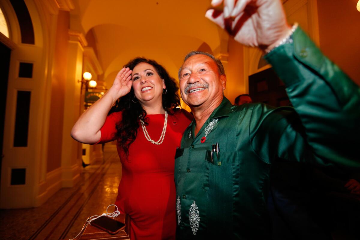 Assemblywoman Lorena Gonzalez (D-San Diego) and Arturo Rodriguez, president of the United Farm Workers of America, at the Capitol in Sacramento after lawmakers passed legislation that would expand overtime pay for more than 825,000 laborers.