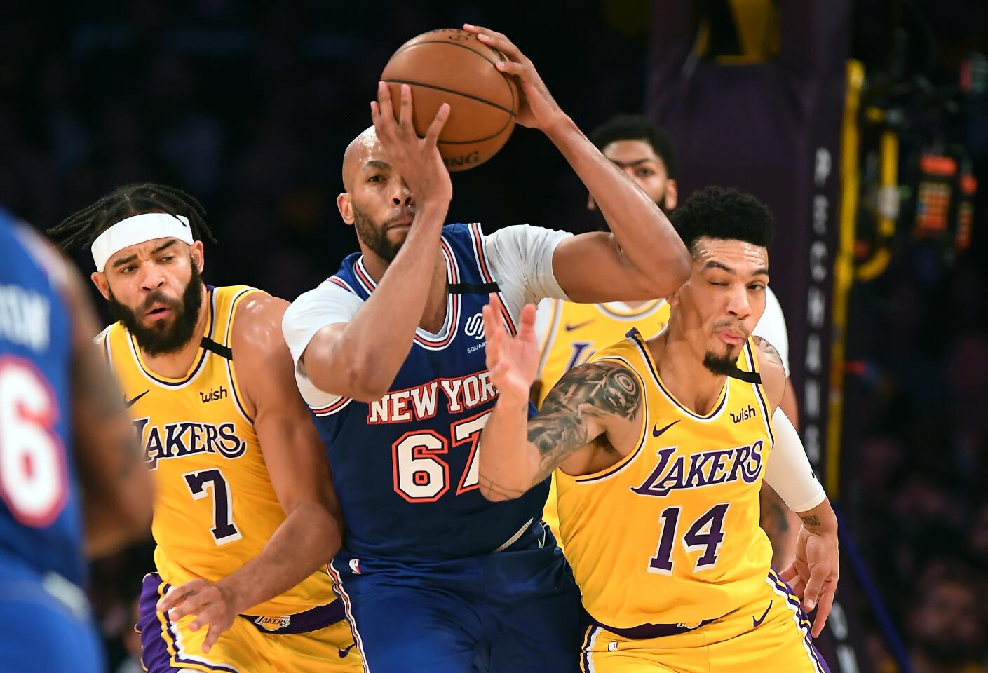 JaVale McGee and Danny Green battle for loose ball with Knicks center Taj Gibson during the first quarter of a game Jan. 7 at Staples Center.