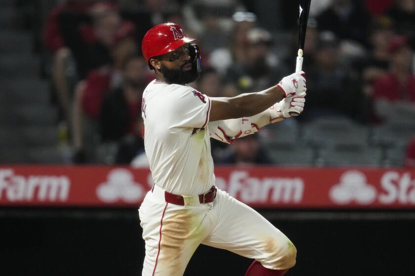 Los Angeles Angels' Jo Adell doubles during the eighth inning of a baseball game.