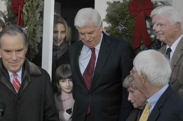 Sen. Christopher Dodd looks down as he makes his way down his front steps wiht his wife Jackie, and daughter Grace, 8. Surrounded by his family and extended family, Sen. Chris Dodd, announced he will not seek reelection to another term as U.S. Senator from Connecticut from the front steps of his East Haddam home. At right is congresman John Larson, behind Dodd's brother.