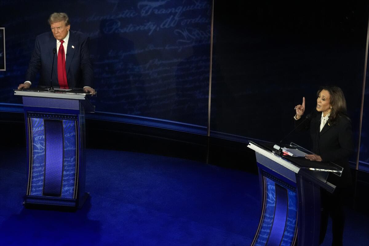 El candidato presidencial republicano y expresidente Donald Trump y la candidata presidencial 