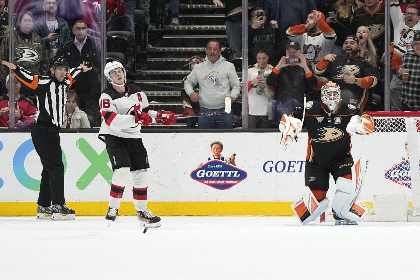Anaheim Ducks goaltender Lukas Dostal, right, celebrates after stopping a penalty shot.