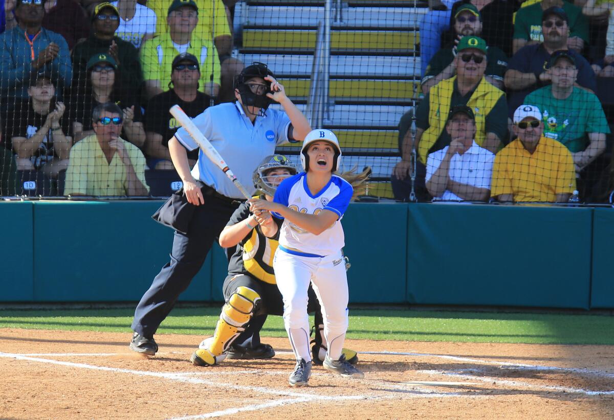 UCLA's Gabrielle Maurice watches the flight of her solo home run in the bottom of the seventh inning to tie the score against Oregon in the second game of their super regional series on Sunday.
